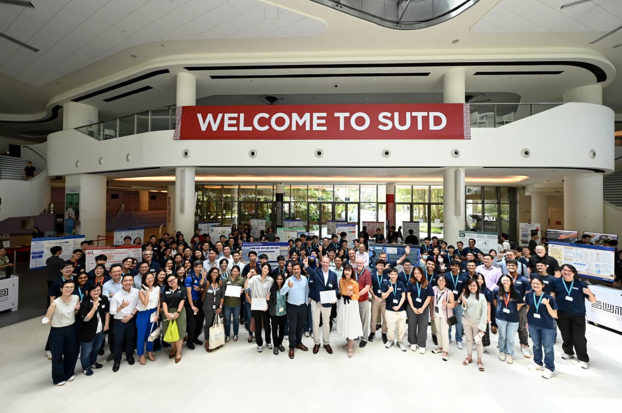 Group photo of all teams and staff at the SUTD project showcase