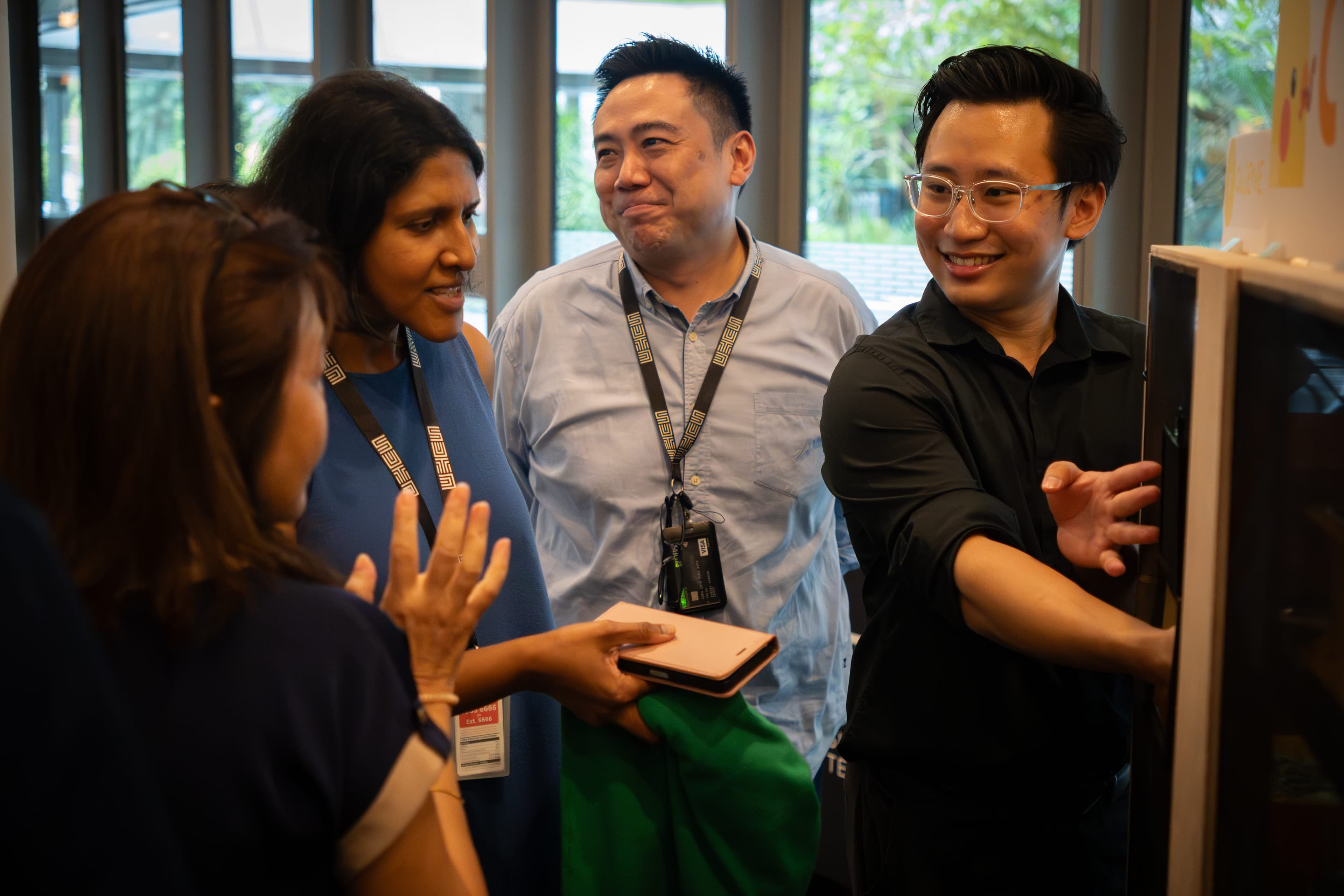 Visitors interacting with the CRUMS unit at the SUTD Capstone Showcase.